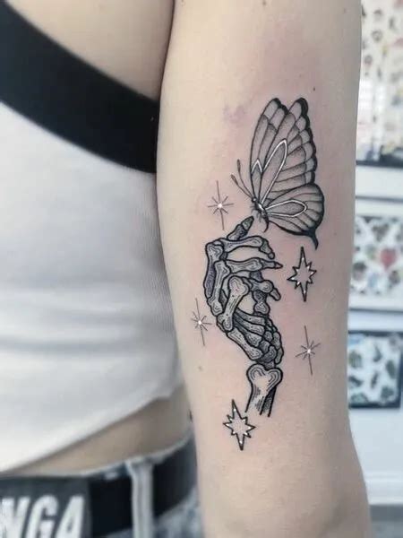 Butterfly And Skeleton Hand Tattoo Forarm Tattoos Bone Tattoos Body