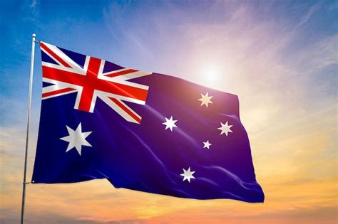 Premium Photo Australia Flag National Hand Hold Under Blue Sky At