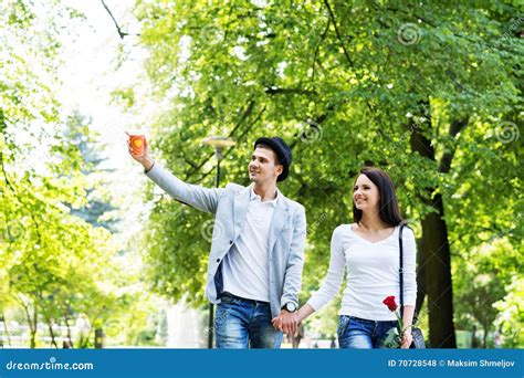 Young Beautiful Couple Having A Date In The Park Stock Photo Image Of