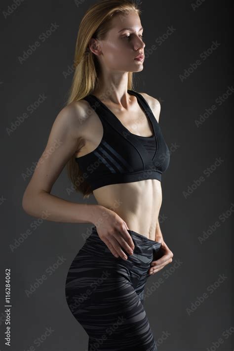 beautiful sexy blonde woman perfect athletic slim figure engaged in yoga exercise or fitness