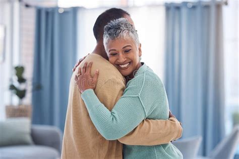 Hug Love And Trust With A Senior Couple Bonding In The Living Room Of