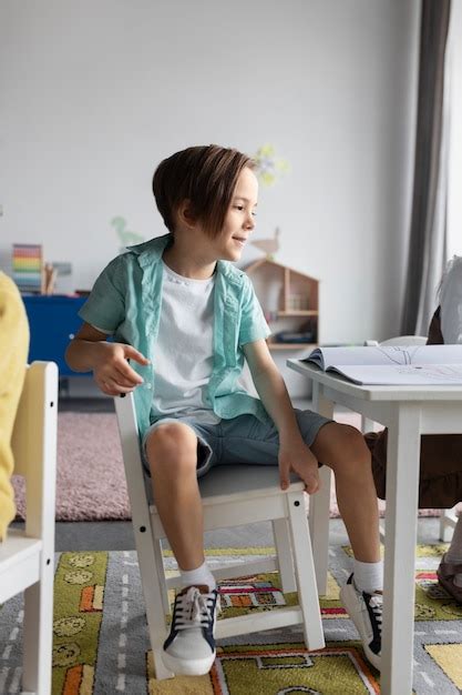 Free Photo | Full shot kid sitting on chair