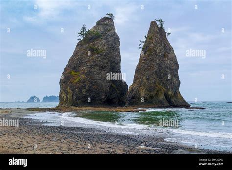 Skies Turn Blue As Morning Sun Highlights The Sea Stacks At Rialto