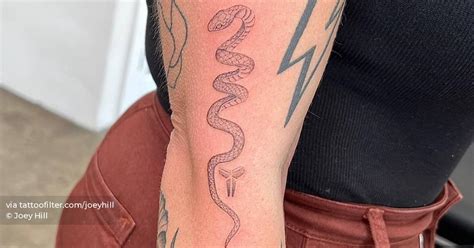 Single Needle Snake Tattoo Located On The Elbow