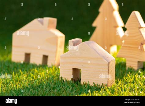 Wooden toy house miniature on grass close up Stock Photo - Alamy