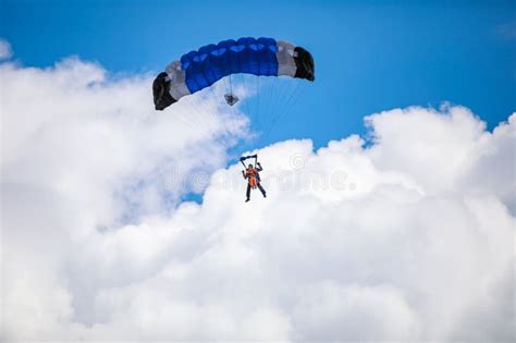 Parachute In The Sky Skydiver Is Flying A Parachute In The Blue Sky