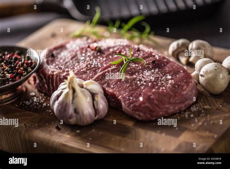 Rib Eye Steak Salt Pepper Spices Garlic And Mushroom Raw Beef Meat On