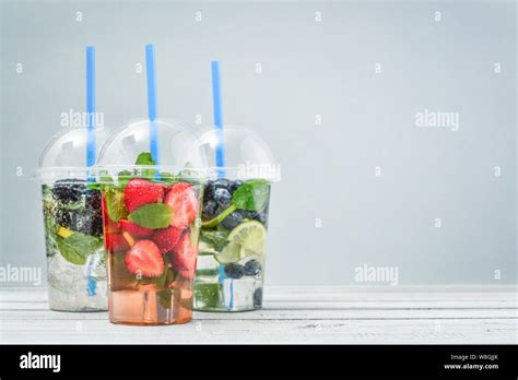 Various Lemonade With Fruits And Berries In A Plastic Cups With Drink