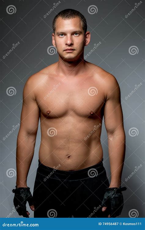 Vertical Naked Muscular Man Covering With A Banner Stock Photo