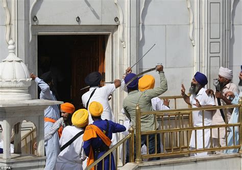 Sword Wielding Sikhs Clash At Indias Golden Temple During Prayers