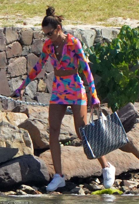 Izabel Goulart flaunts her supermodel figure and pert derrière in a tiny thong bikini Daily