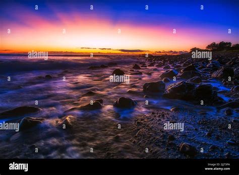 Dark Dawn Scenic Seascape Sunrise Over Pacific Ocean Horizon At Pebbly