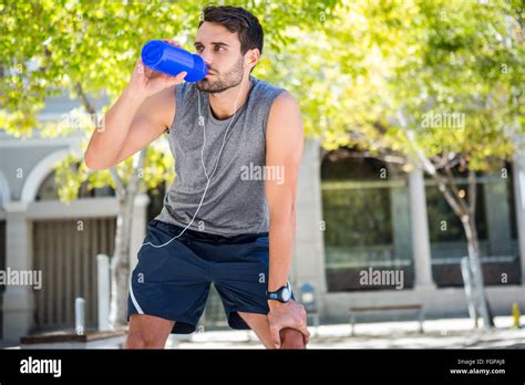 Handsome Runner Drinking Fresh Water Stock Photo Alamy