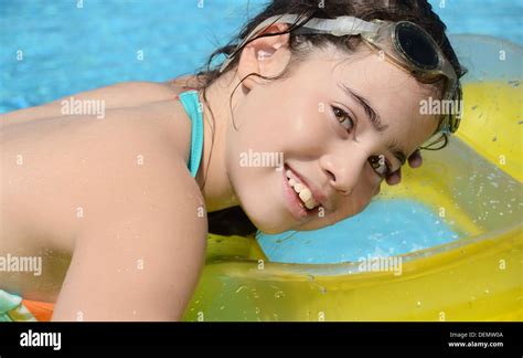 Teenage Girl Resting In The Pool Young Woman Resting On A Floating