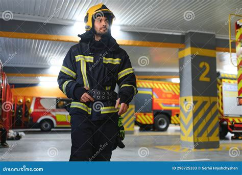 Fireman Wearing Protective Uniform Standing in Fire Department at Fire ...