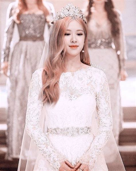 A Woman In A Wedding Dress Standing Next To Two Other Women Wearing