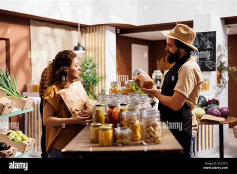 Customer Shopping For Vegan Ecofriendly Pantry Staples In Zero Waste