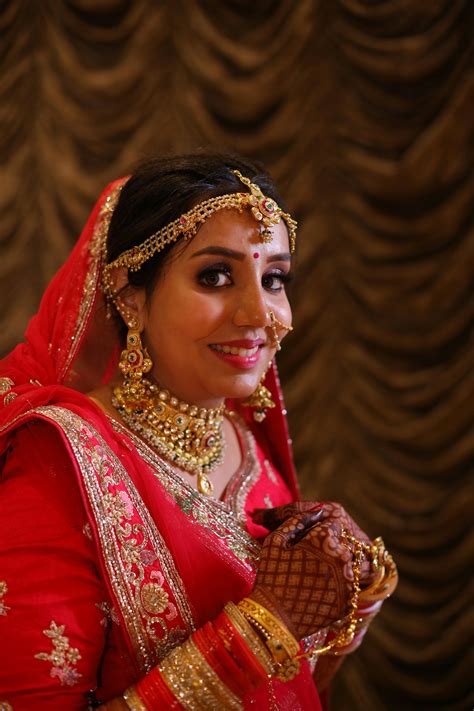 Indian Bride Wearing Traditional Wedding Outfit and Jewelry · Free