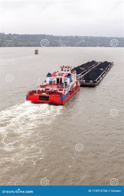 Tugboat Pushing A Heavy Barge Stock Photo Image Of Commercial Ship