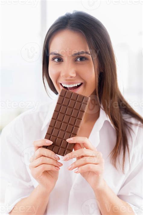 Girl Enjoying Chocolate Cheerful Young Smiling Woman In White Shirt