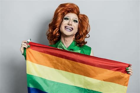 Premium Photo Happy Drag Queen Holding Rainbow Flag Lgbtq Concept