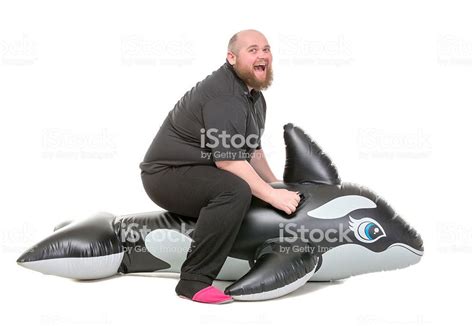 Man rides rubber dolphin : r/wtfstockphotos