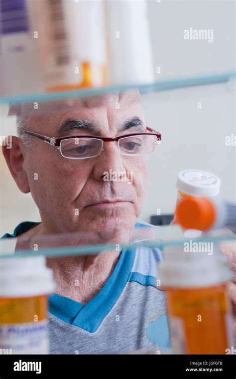 Man Holding Bottle Supplement Vertical Hi Res Stock Photography And