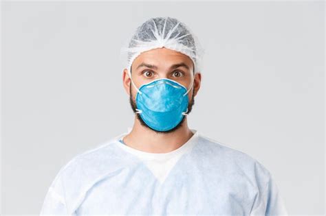 Premium Photo Portrait Of Man Wearing Mask Against White Background