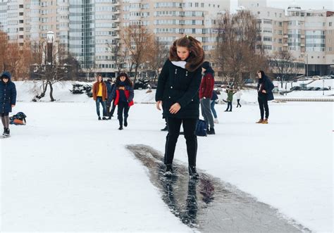 Walking On The Ice Of A Frozen River Girl Is Riding On Ice Walking On