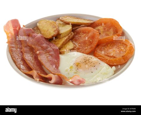 Cooked Breakfast With Streaky Bacon And Egg Stock Photo Alamy