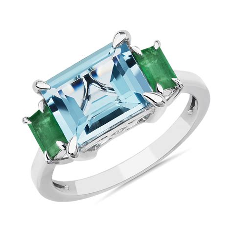 3 Stone Emerald Cut Blue Topaz And Baguette Emerald Sidestone Fashion Ring In 14k White Gold