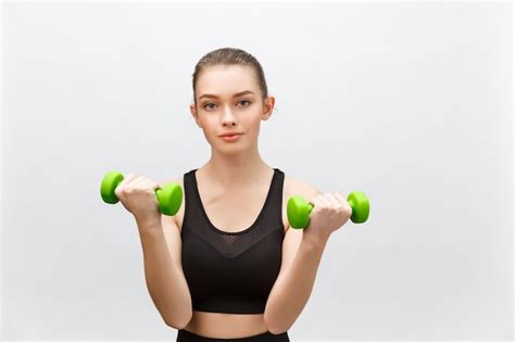 Premium Photo Happy Fitness Woman Lifting Dumbbells Smiling Cheerful