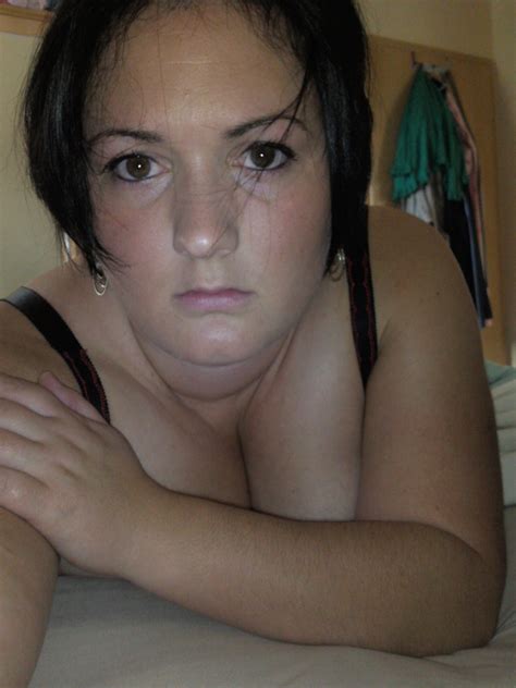 Busty Brunette Wife Showing Off Her Assets At HomeMoviesTube