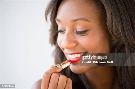 African American Applying Lipstick Photos And Premium High Res Pictures