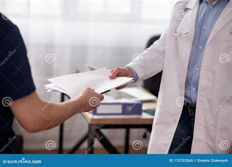 Close Up Picture Of Mans Hands Passing The Documents Stock Image