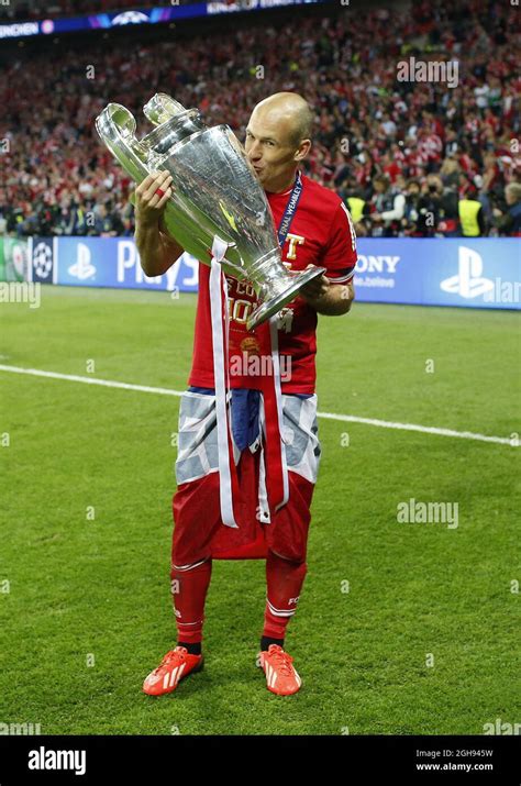 Munich S Arjen Robben Celebrates With The Trophy During The Uefa