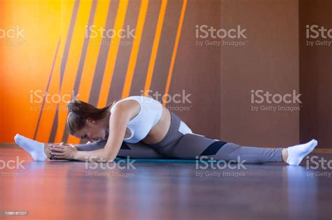 Beautiful Pregnant Woman Doing Stretching Exercises Sitting On The