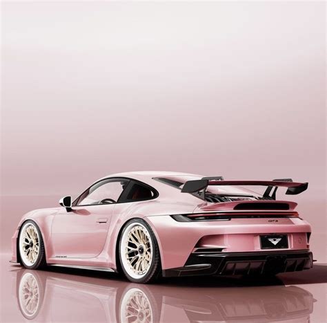 A Pink Porsche Sports Car On A Reflective Surface