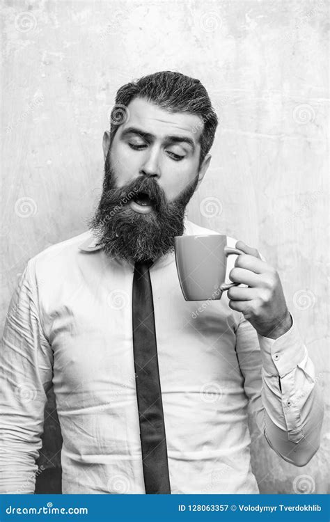 Bearded Man With Curious Face Look Into Tea Coffee Cup Stock Image