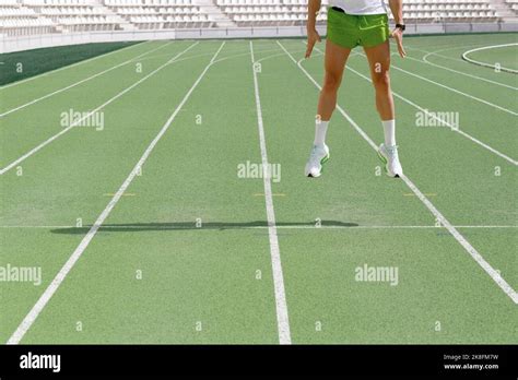 Athlete Jumping On Running Track Stock Photo Alamy