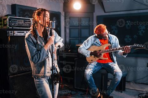 Guy Plays Guitar Girl Sings African American Man With White Girl