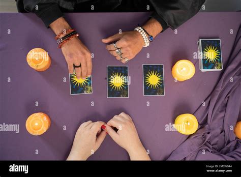 Man Fortune Teller Holding Tarot Cards In His Hands And Unrecognizable