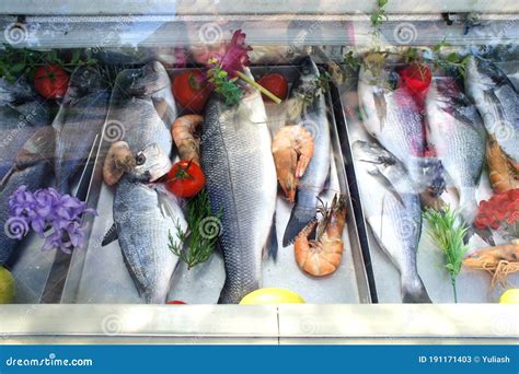 Fresh Fish And Shrimp On The Store Counter Seafood On Display In The