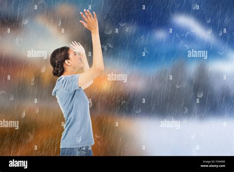 Composite Image Of Pretty Brunette Cheering Stock Photo Alamy