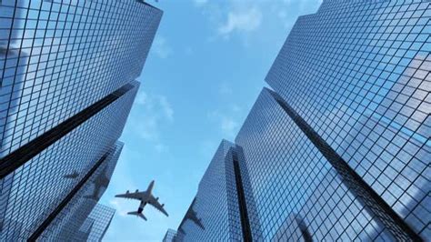 A Plane Flying Over Tall Buildings Motion Graphics VideoHive