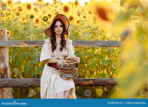 Beautiful Woman In A Dress In A Field Of Sunflowers Stock Image Image