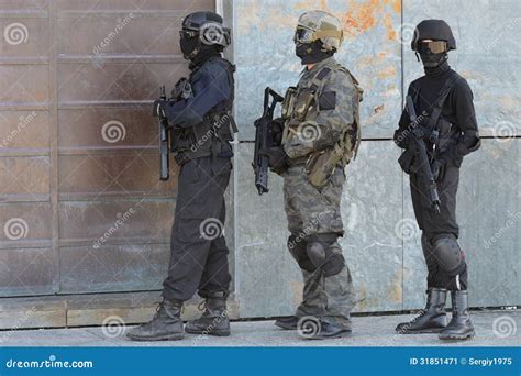 Police Special Forces Officer In Black Uniform Stock Photography | CartoonDealer.com #58029890