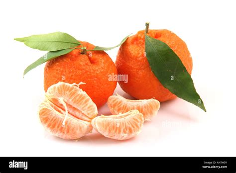 Two Mandarins With Leaf And Slices Isolated On White Background Fruits