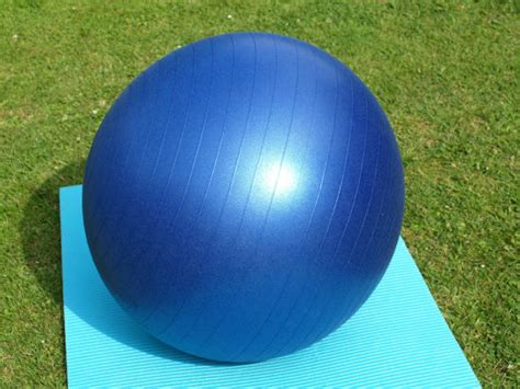 swiss ball   yoga mat outdoors