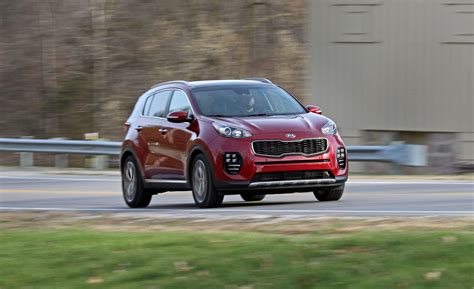 kia sportage review pricing  specs